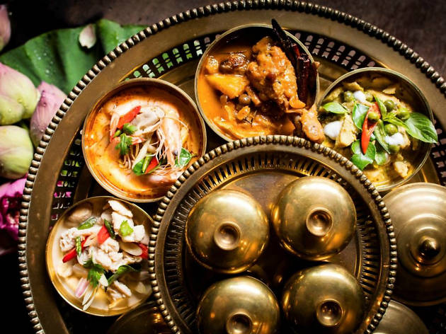 Fine dining in Bangkok for Tourism Thailand promo An array of Thai dishes on a brass plate