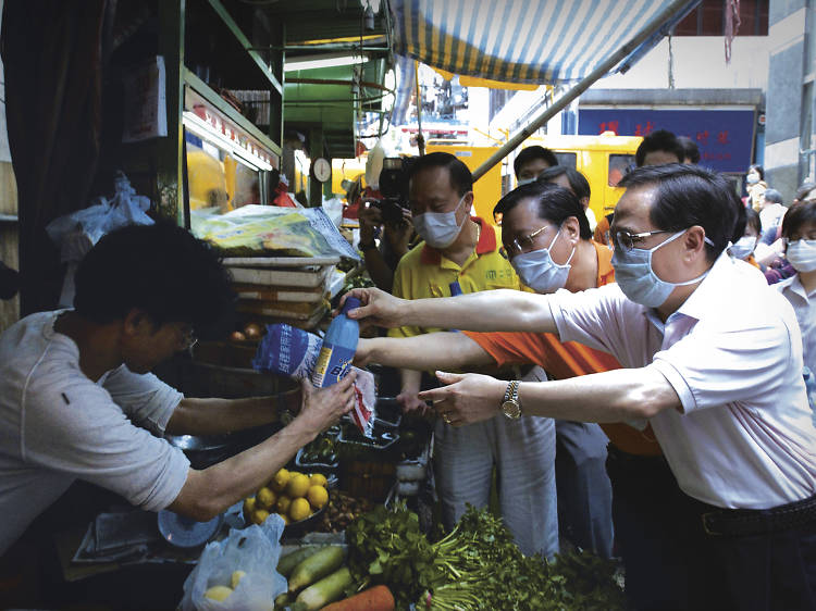 Donald Tsang, then Chief Secretary for Administration, visits the market