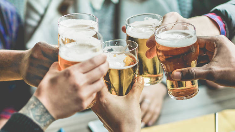 Group clinking beer glasses