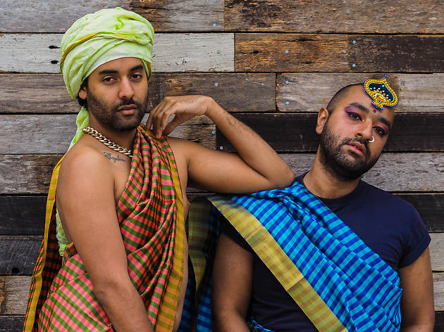 2 Boys in Saris The 2 Boys in Saris pose in front of a wooden wall