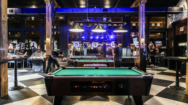 Pool table in an arcade