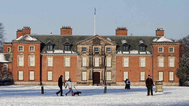 People enjoy the winter weather at Dunham Massey, Greater Manchester.