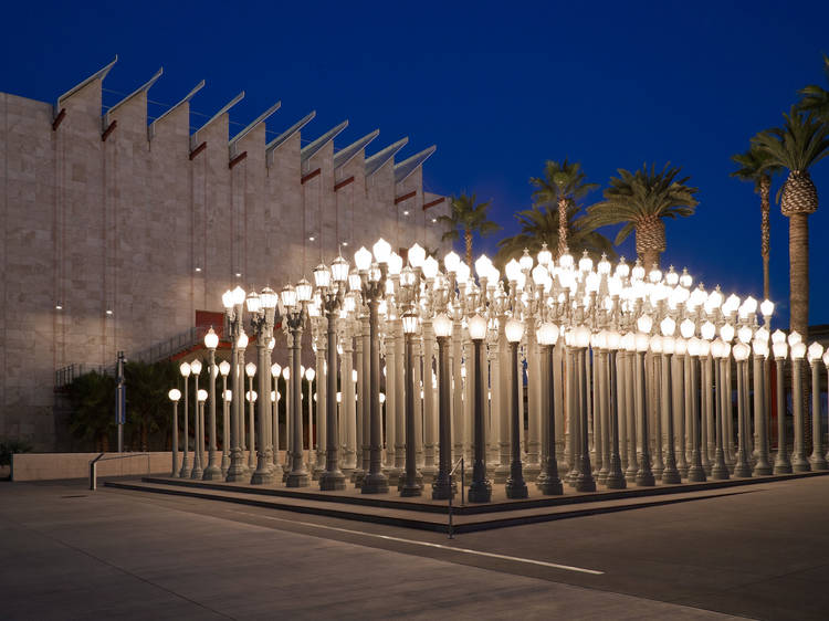 Pose in front of streetlights at LACMA