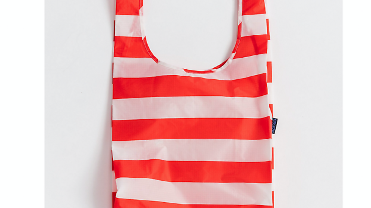 Double-duty beach tote that folds neatly in your clutch for those impromptu trips to the sand