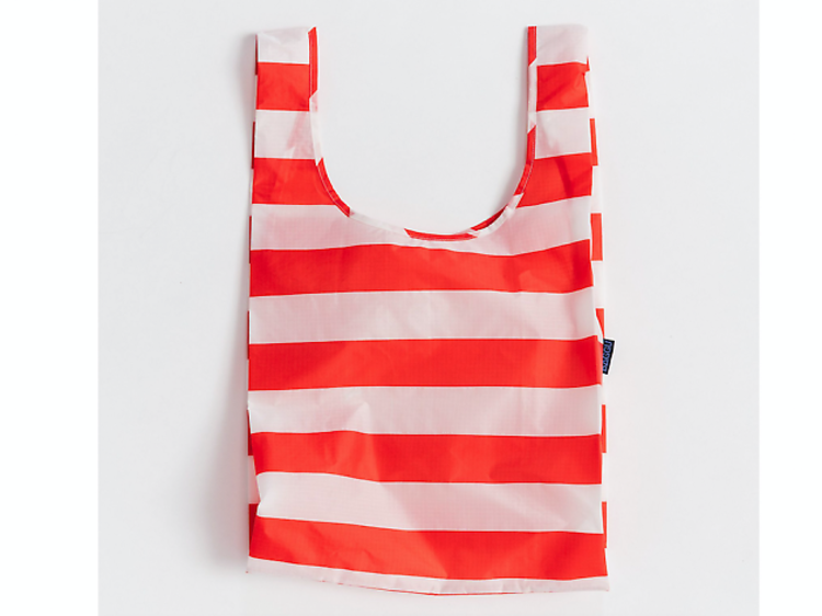 Double-duty beach tote that folds neatly in your clutch for those impromptu trips to the sand
