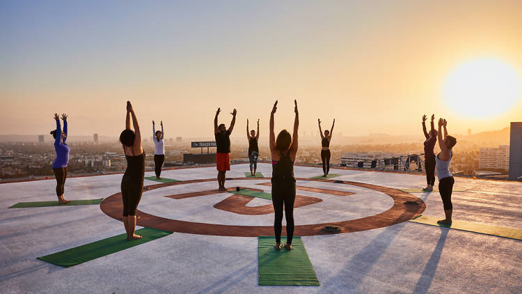 Do yoga on a helipad rooftop