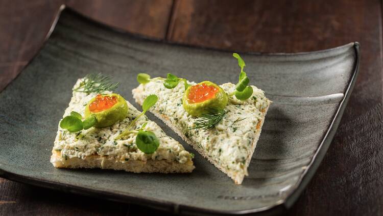 Sand crab on toast, trout roe, avocado at Stokehouse Q, $18