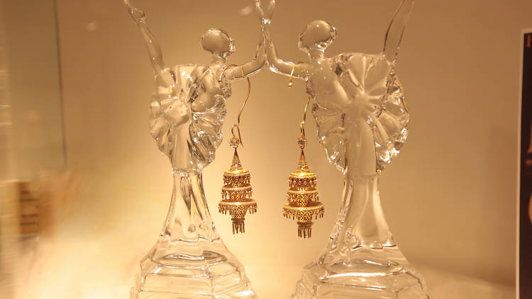 A dazzling pair of dangling gold earrings at Vogue Jewellers