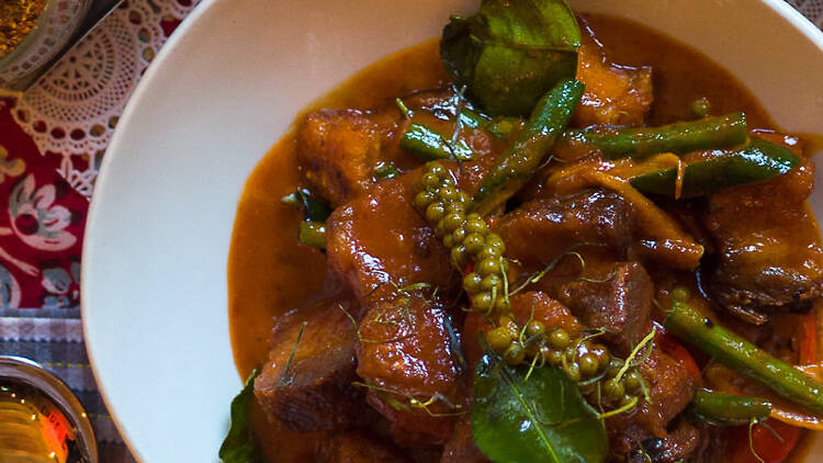 Braised pork belly with dry red curry at Magic Mountain Saloon