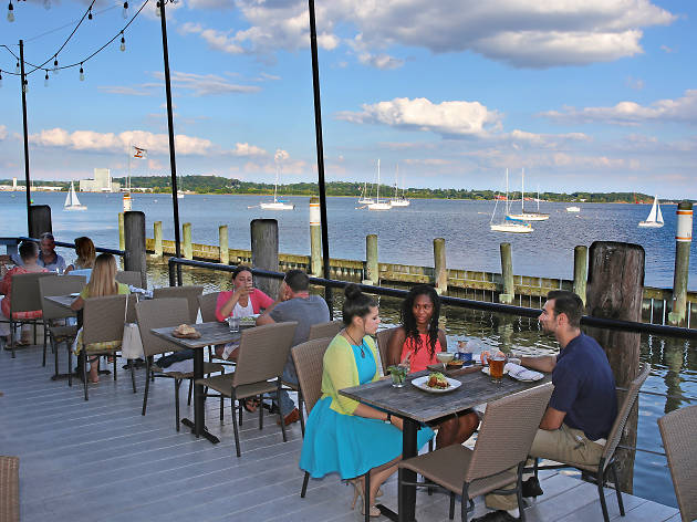Shell and Bones Connecticut Diners eat by the water at Shell and Bones Connecticut