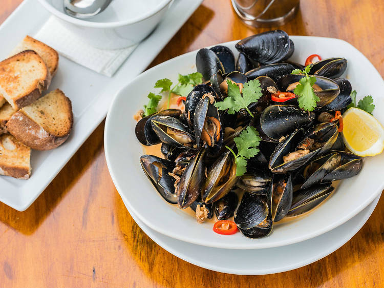Steamed mussels In red curry broth at Shelter Bar, Story Bridge Hotel, $28.50