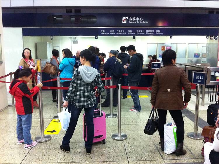 Suitcases on the MTR during rush hour