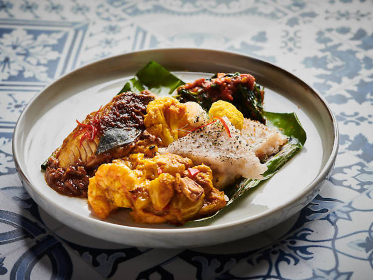 Nasi tekan with assorted curries