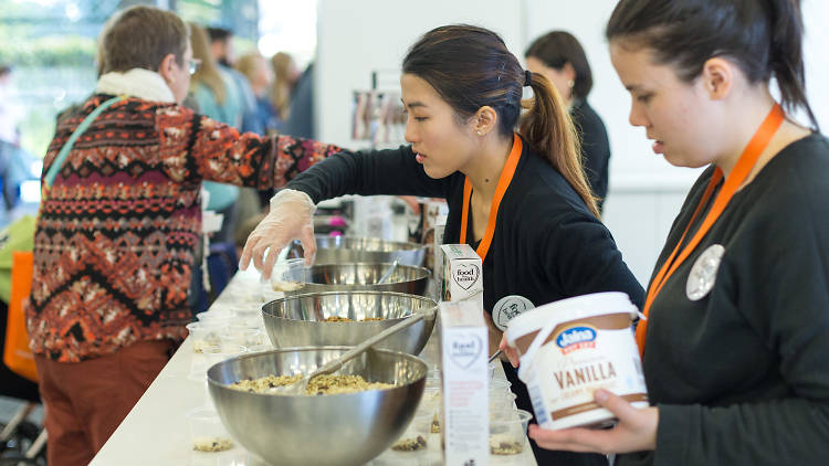 Woman serving granola.