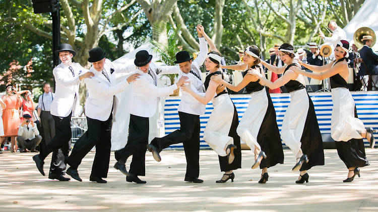 A group of people dance at the Jazz Age Lawn Party in 2018.