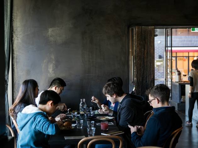 People sitting inside eating at Edition Coffee Roasters People sitting inside eating at Edition Coffee Roasters