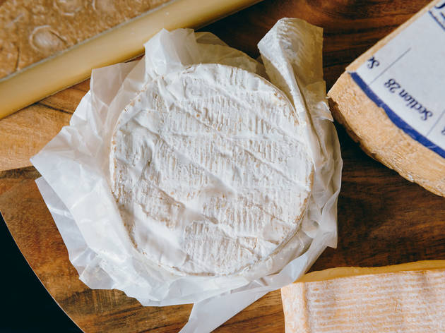 Penny's Cheese Shop A wheel of white mould cheese