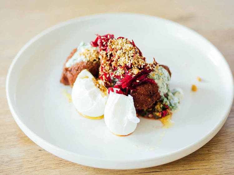 Falafel, autumn tabouli, green tahini, beetroot pickle and poached eggs at Babajan, $21