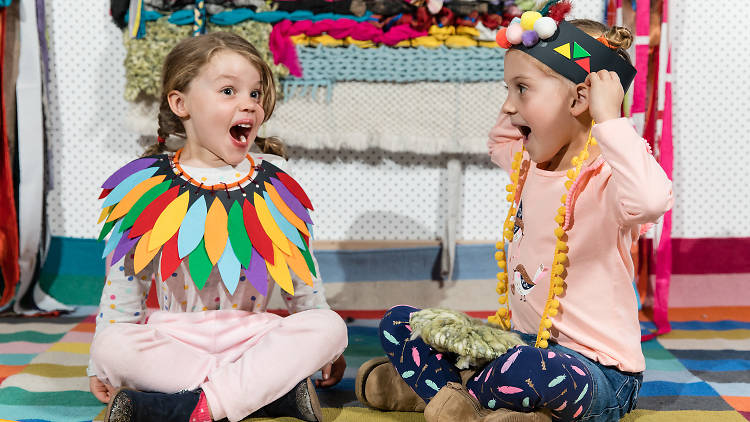 Kids playing with dress-ups.