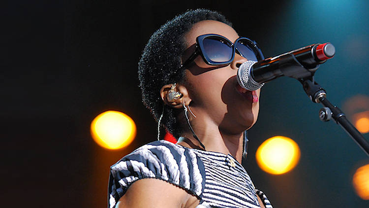 Lauryn Hill singing into microphone