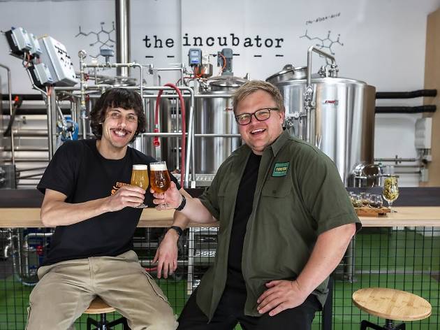 The Incubator Two men enjoying beer at Fixation Brewing Company