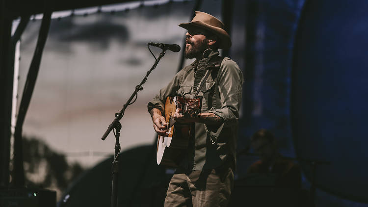 LaMontagne sings while playing a guitar.