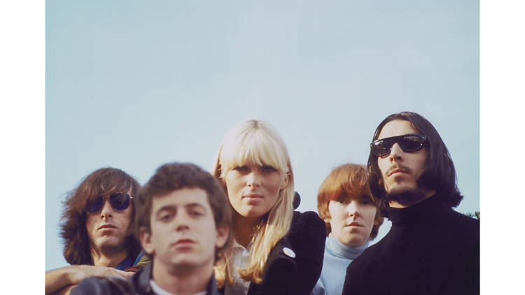 A color photo of the band and Nico