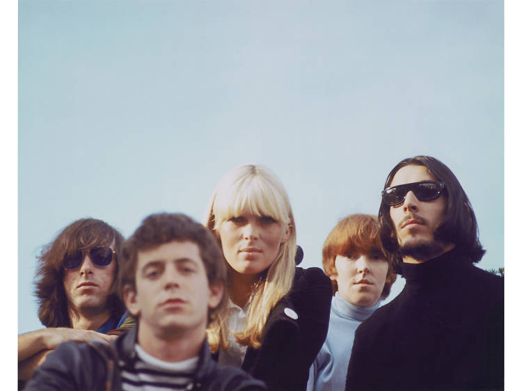 A color photo of the band and Nico