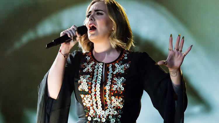 Adele performing live on stage