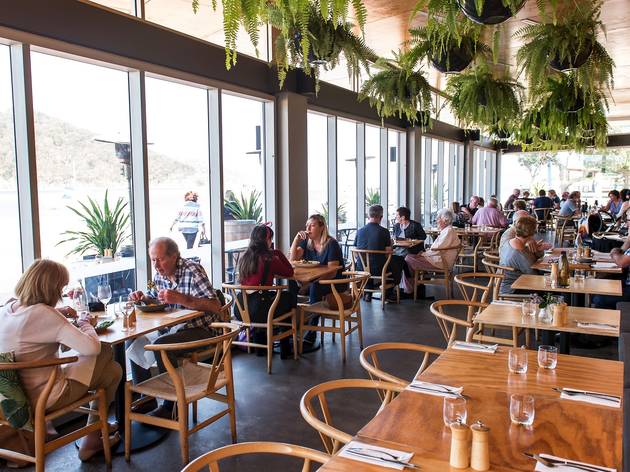 People eating outside Of box on the water central coast