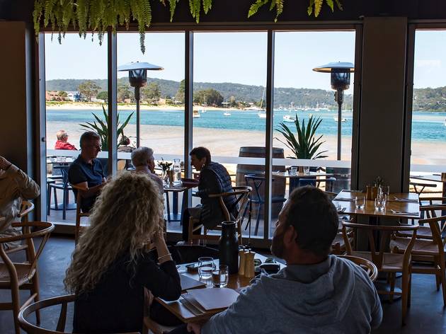 People eating outside Of box on the water central coast