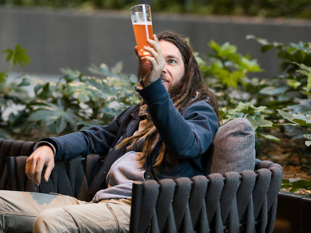 Sydney Beer Week Sponsored Content Man observing beer at Sydney Beer Week Sponsored
