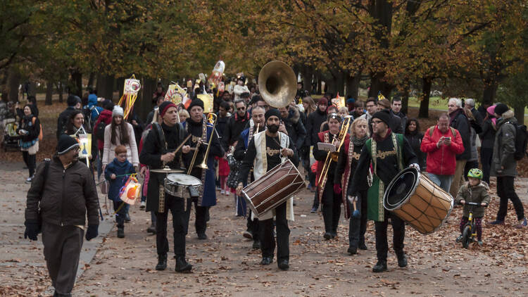 The procession lighting up the riverbank