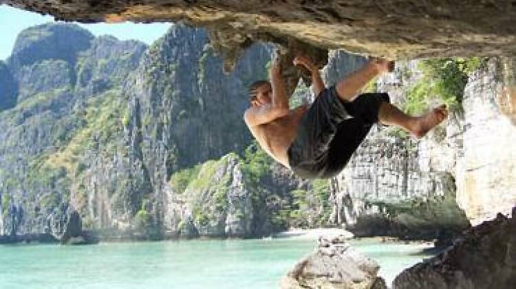 Rock climb on limestone cliffs above white sand beaches