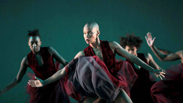 Woman dancing in red outfits.