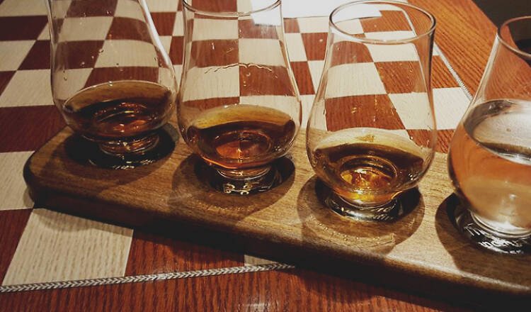 Find bourbon flights in this Craftsman-style lounge