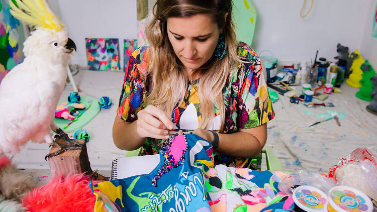 Artist Rosie Deacon sewing sequins on fabric