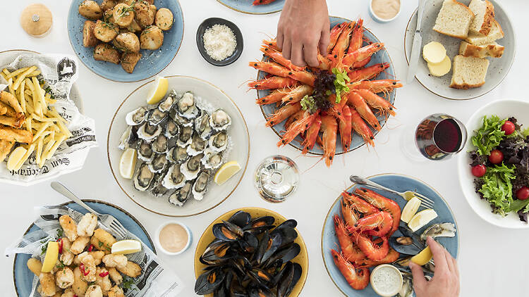 Plates of seafood from above.