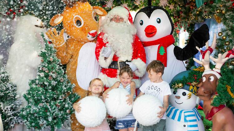 Kids posing with Santa.