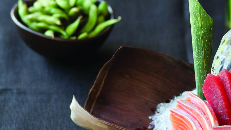 Sushi on ice and edamame.