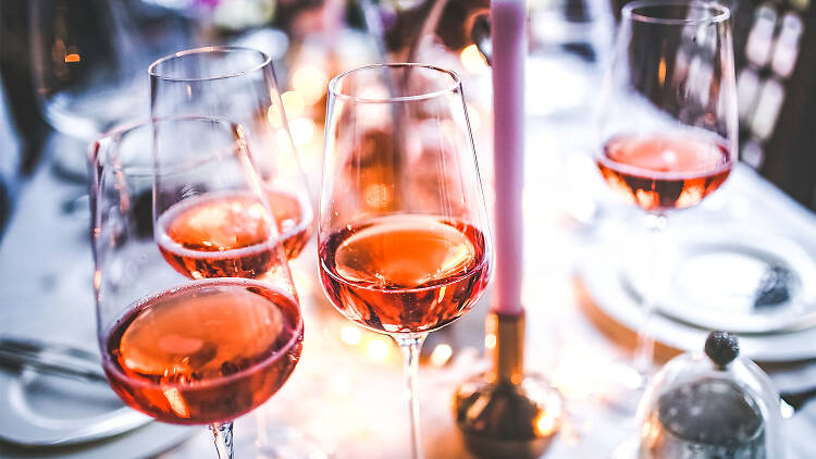 Glasses of rosé on a table.
