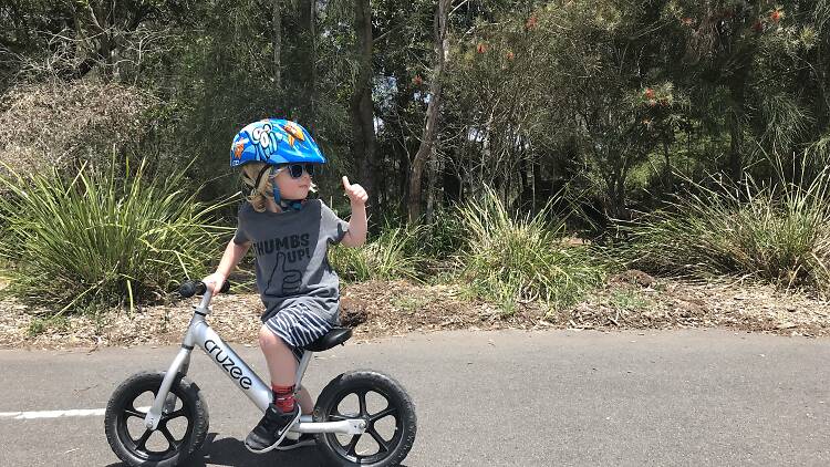 Kid riding a bike.