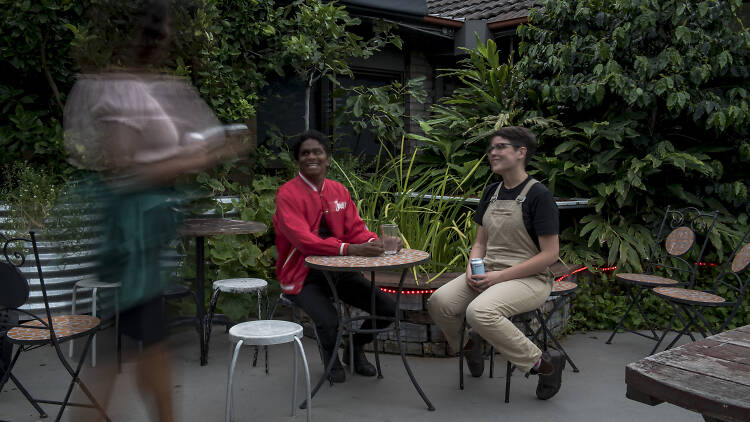 People sitting on the rooftop at 107 Projects