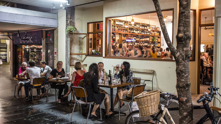 Diners eating outside at Redfern Continental