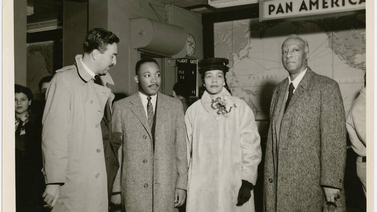 Dr. Martin Luther King, Jr. and his wife Coretta being greeted by Rev. Adam Clayton Powell, Jr. (left) and labor leader A. Philip Randolph (right) at the Pan American World Airways terminal, in New York City