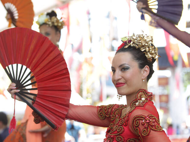 Lunar New Year performer Woman performs traditional dance.
