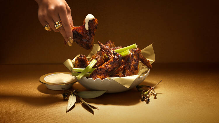 Chicken wings and dipping sauce.