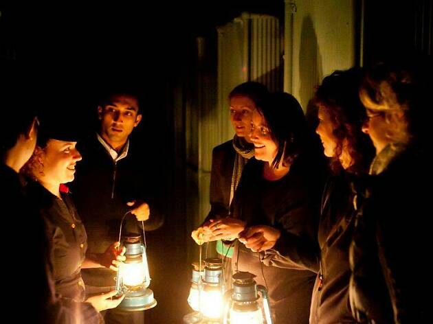 People holding lanterns in Quarantine Station.