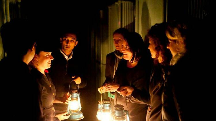 People holding lanterns in Quarantine Station.