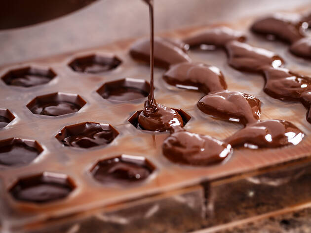 Putting chocolate in mold Putting chocolate in mold
